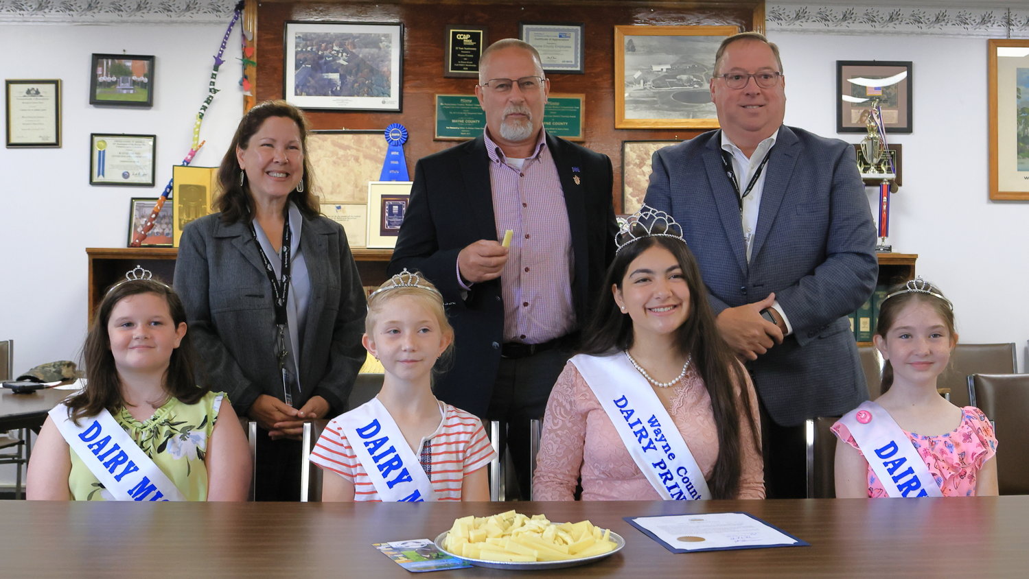Wayne County Dairy Princess Electra Kahagias and her Court pose with the Wayne County Commissioners after receiving a copy of the Proclamation naming June as Dairy Month and July as Ice Cream Month in Wayne County. Seated from left are Dairy Miss Kenley Roberts, Dairy Miss Chloe Tyler, 2022 Wayne County Dairy Princess Electra Kahagias, Dairy Miss Zoe Tyler; standing from left: Wayne County Commissioners Jocelyn Cramer, Brian Smith and Joseph Adams.